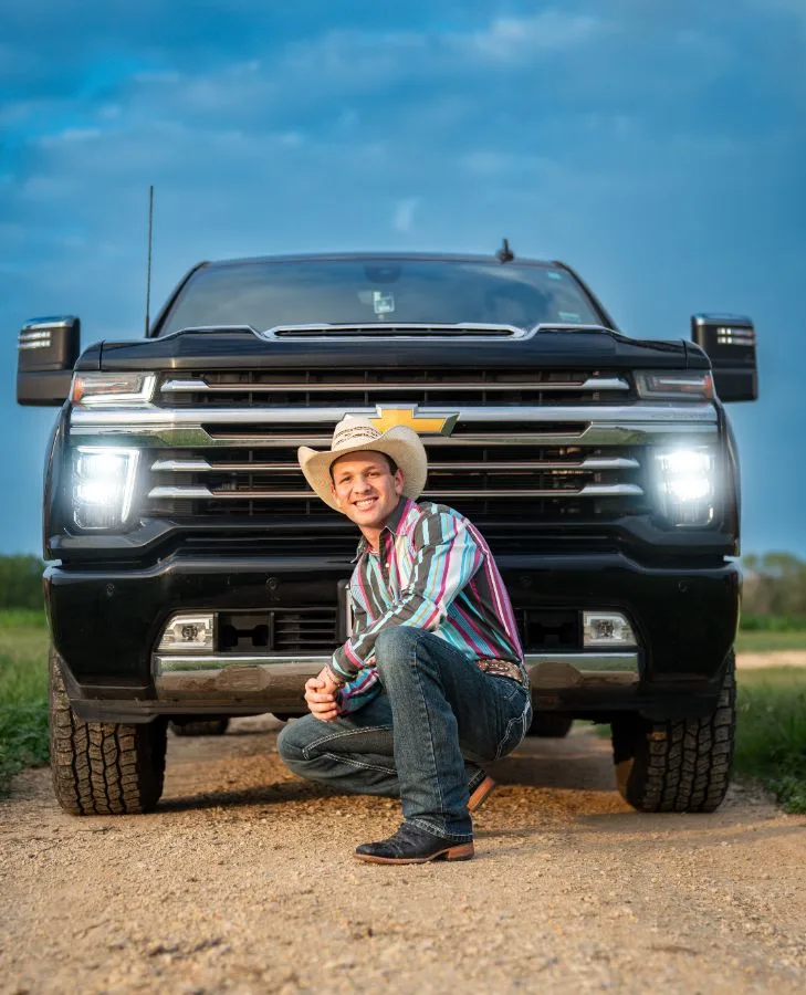 Senior in a cowboy hat with his truck